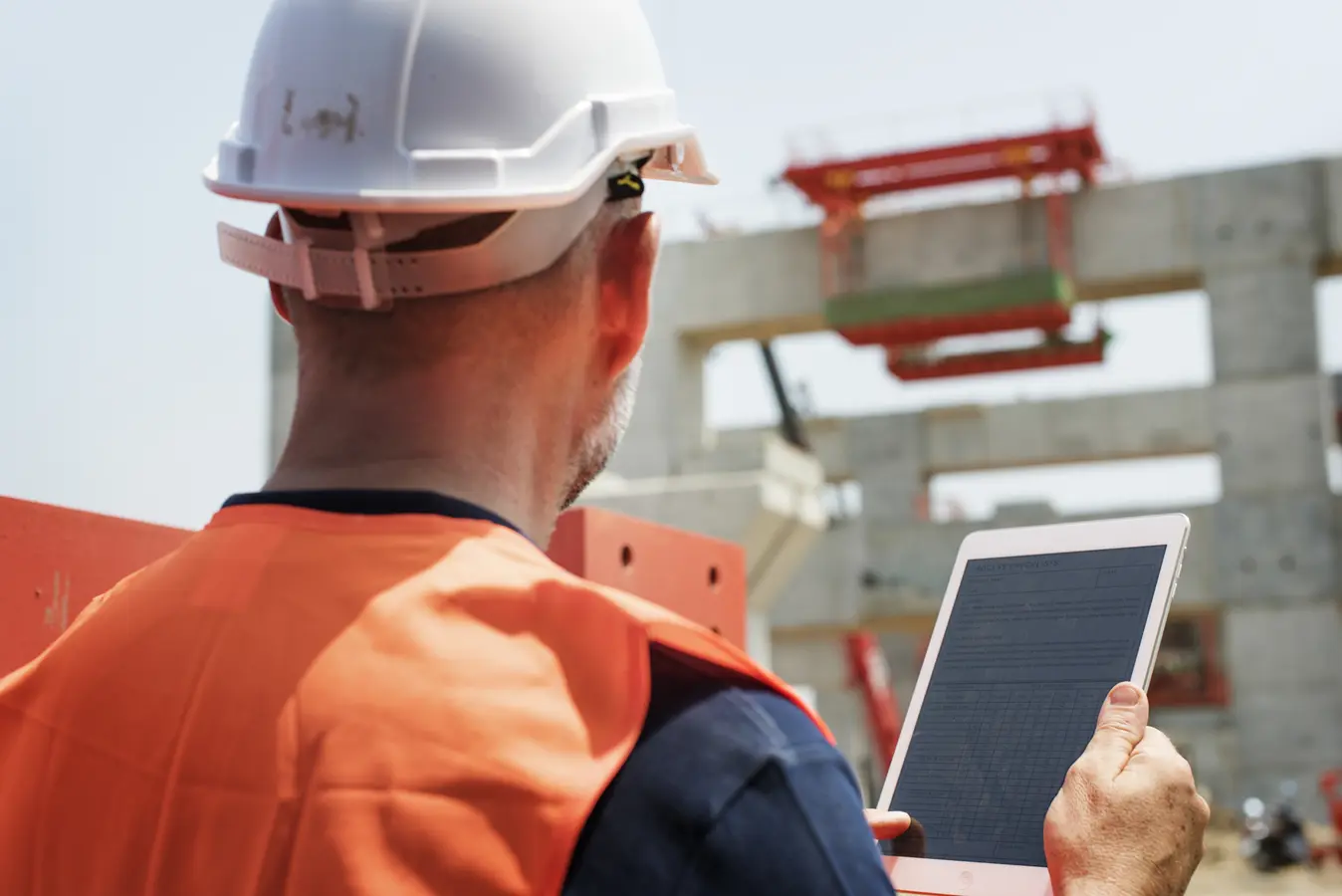 Construction worker reviewing project outdoors